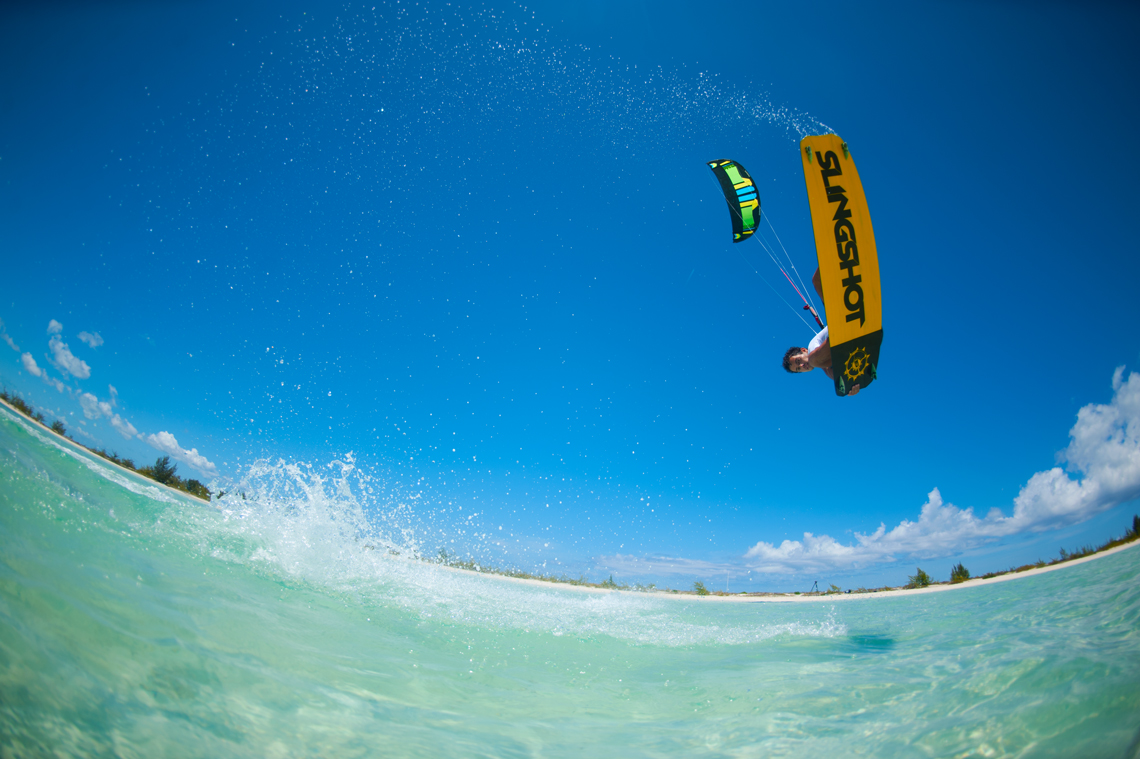 Kiteboarder Victor Hays with a jump and tail grab on the 2016 Slingshot Rally kite and Misfit kiteboard.