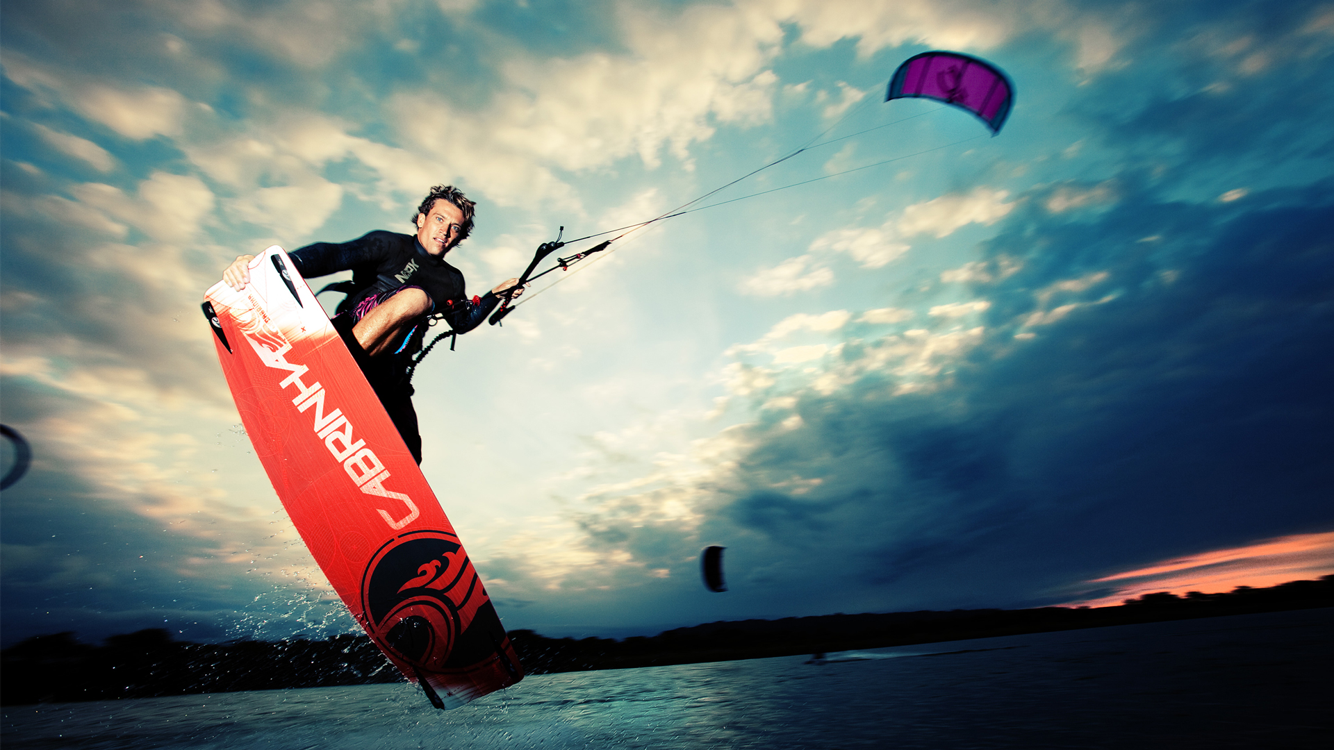 kitesurf wallpaper image - Damien LeRoy with a tailgrab at dusk on his Cabrinha kites gear - in resolution: High Definition - HD 16:9 1920 X 1080