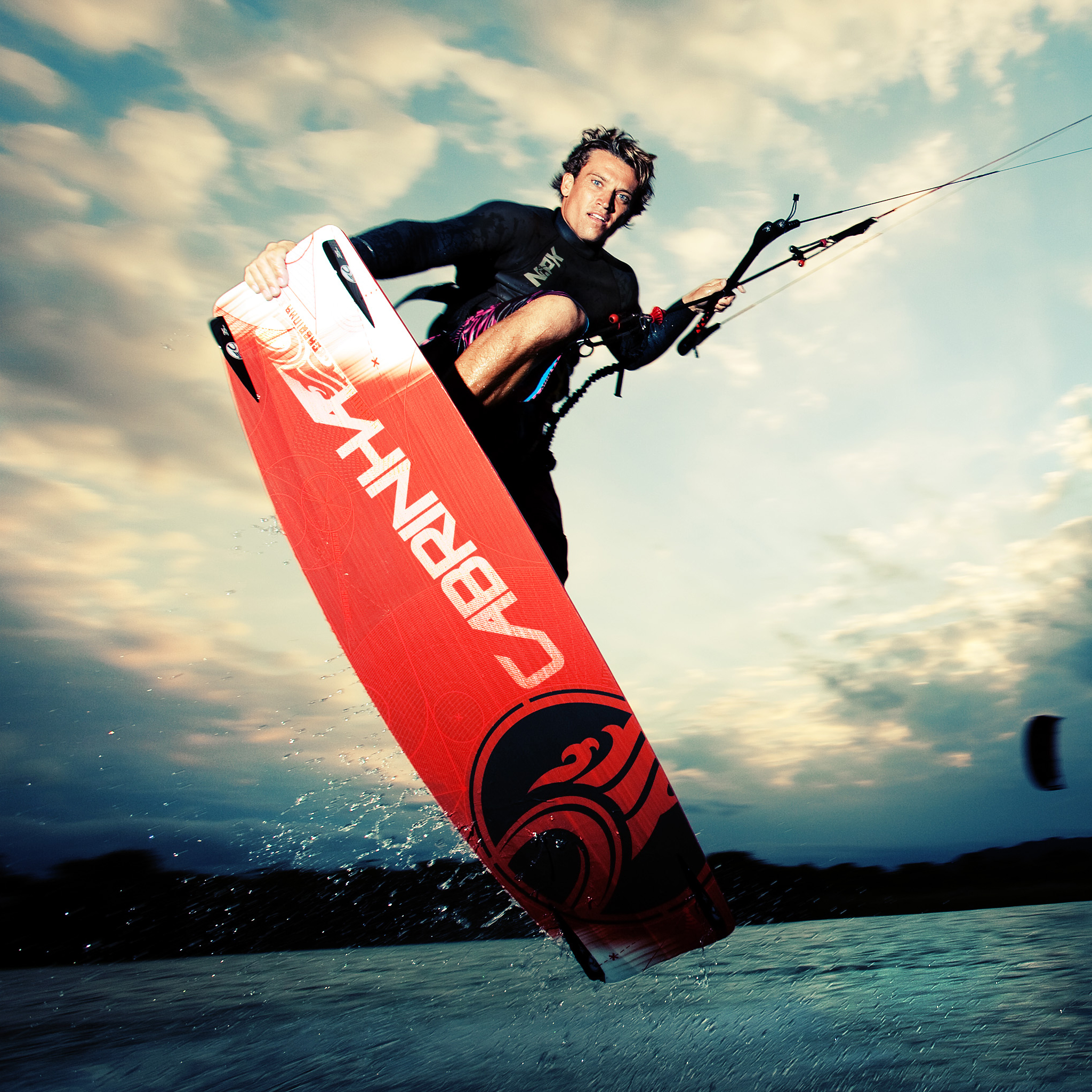 kitesurf wallpaper image - Damien LeRoy with a tailgrab at dusk on his Cabrinha kites gear - in resolution: iPad 2 & 3 2048 X 2048