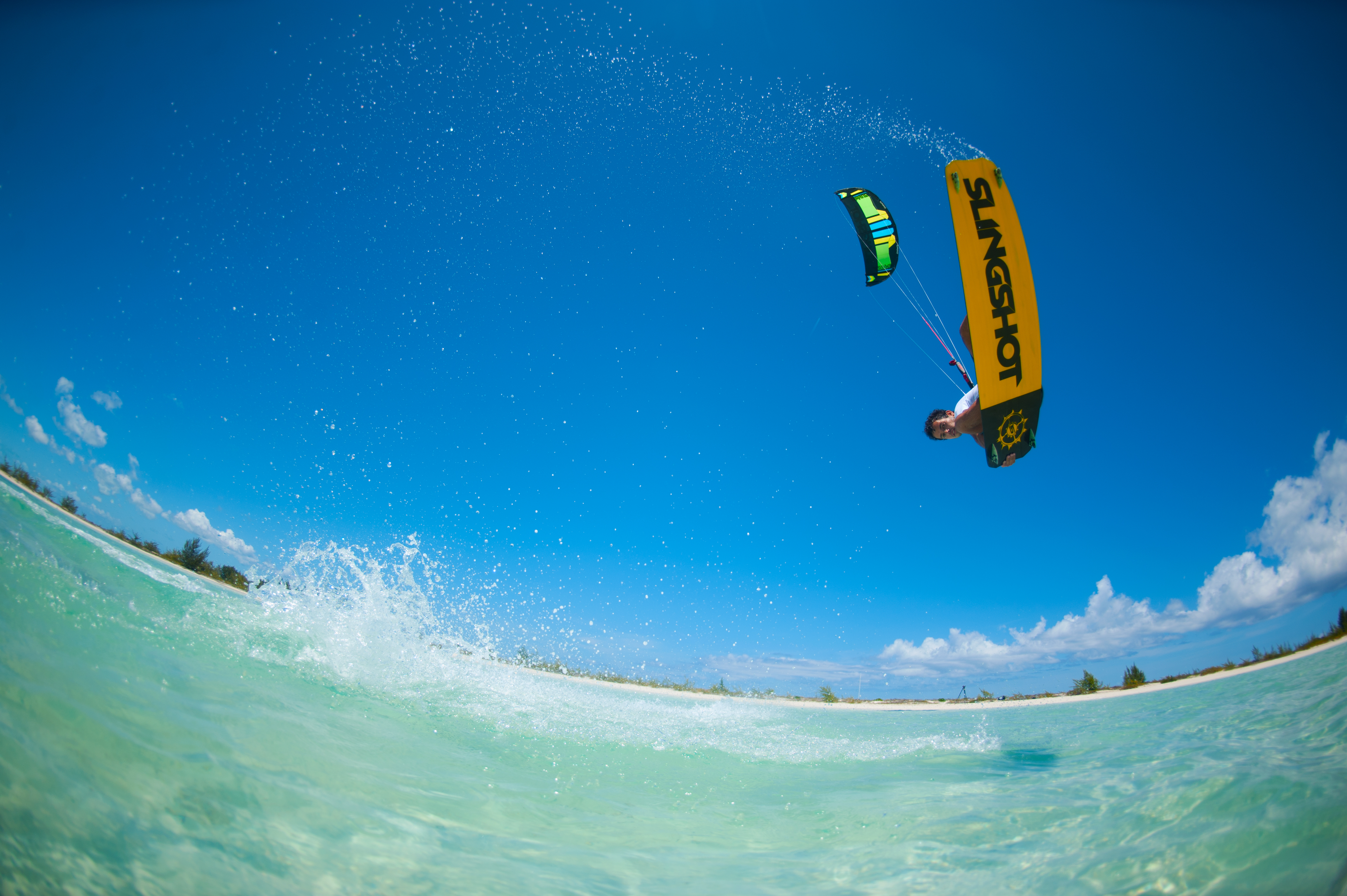 kitesurf wallpaper image - Kiteboarder Victor Hays with a jump and tail grab on the 2016 Slingshot Rally kite and Misfit kiteboard. - in resolution: Original 4256 X 2832