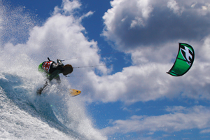 Backside shred by Mitu Monteiro off a wave and on the F-One Bandit kite.